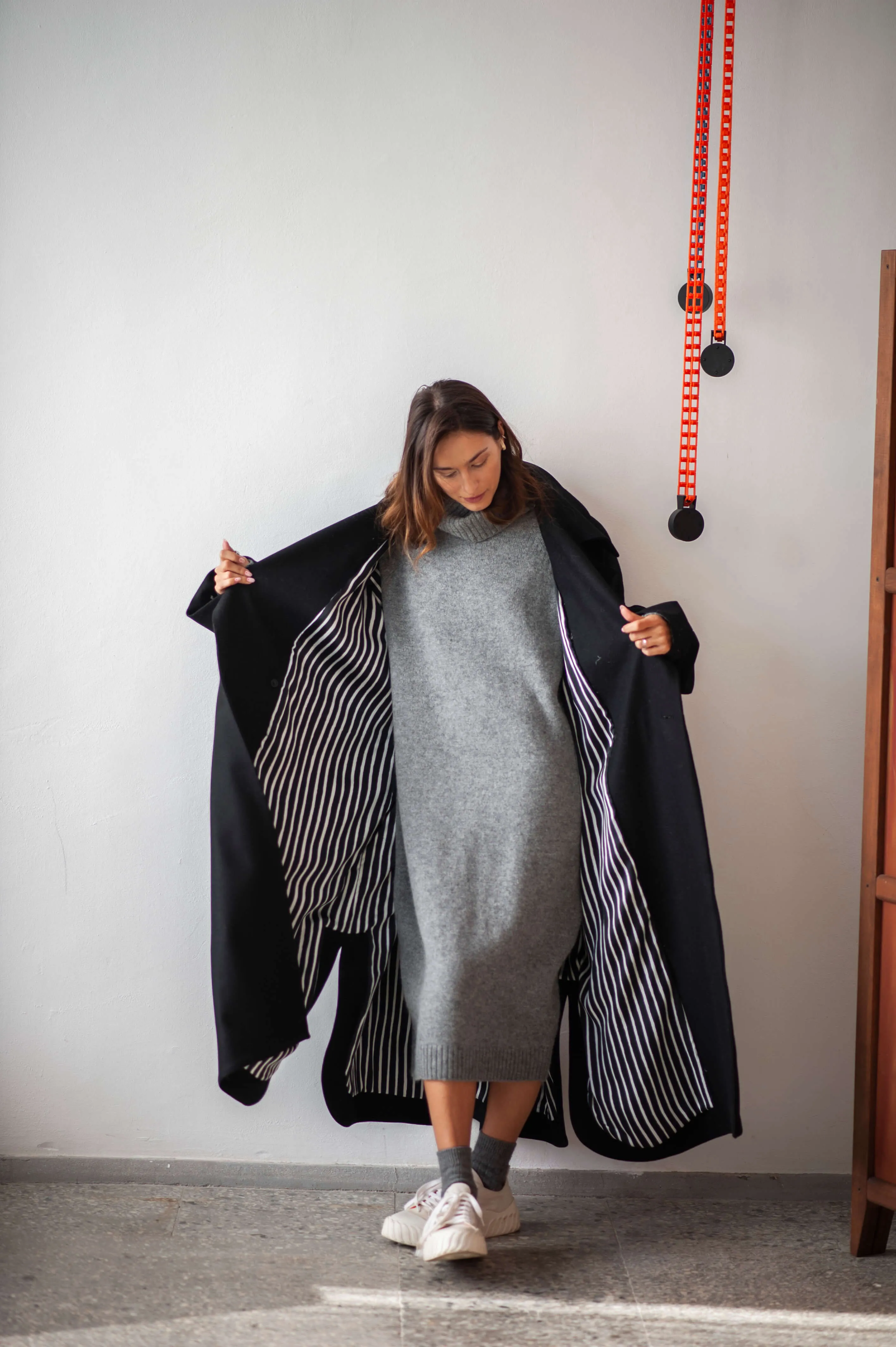 Women's oversized black wool coat with a belt