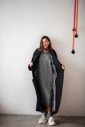 Women's oversized black wool coat with a belt