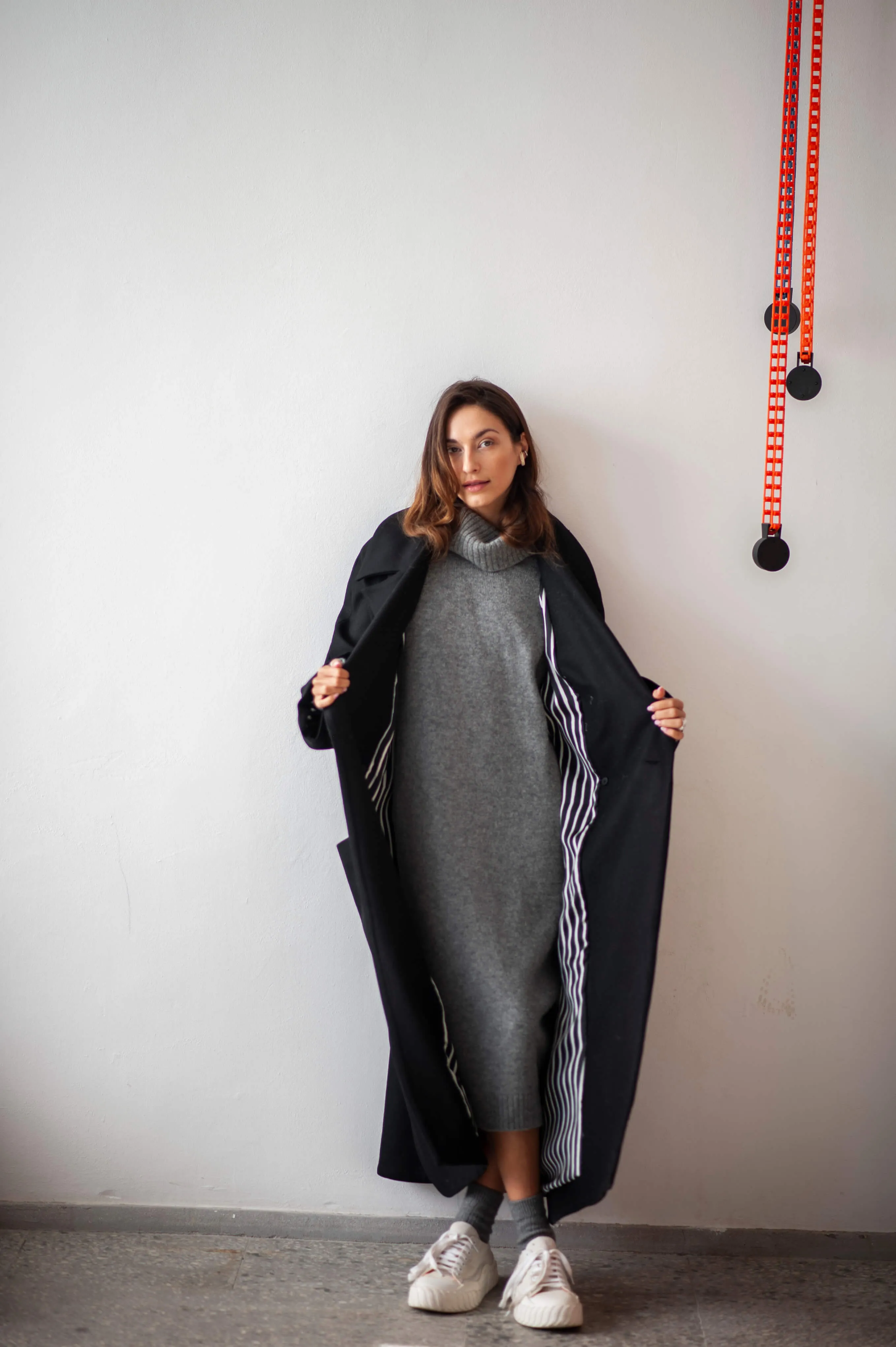 Women's oversized black wool coat with a belt